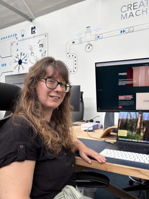 Rachel sitting at her desk in the Fanatic office